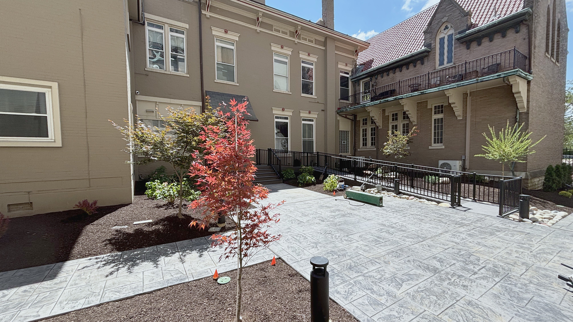 April to August: the old wood deck, and the rebuilt courtyard