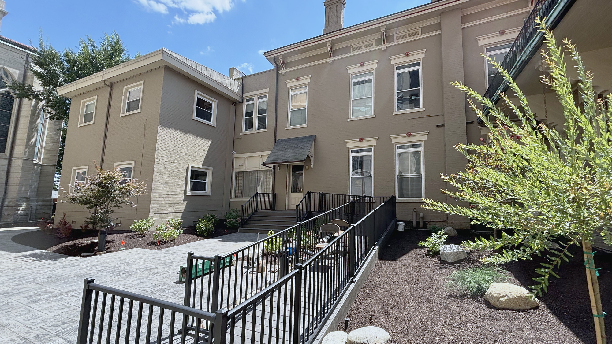 New composite steps and railing at the courtyard entry
